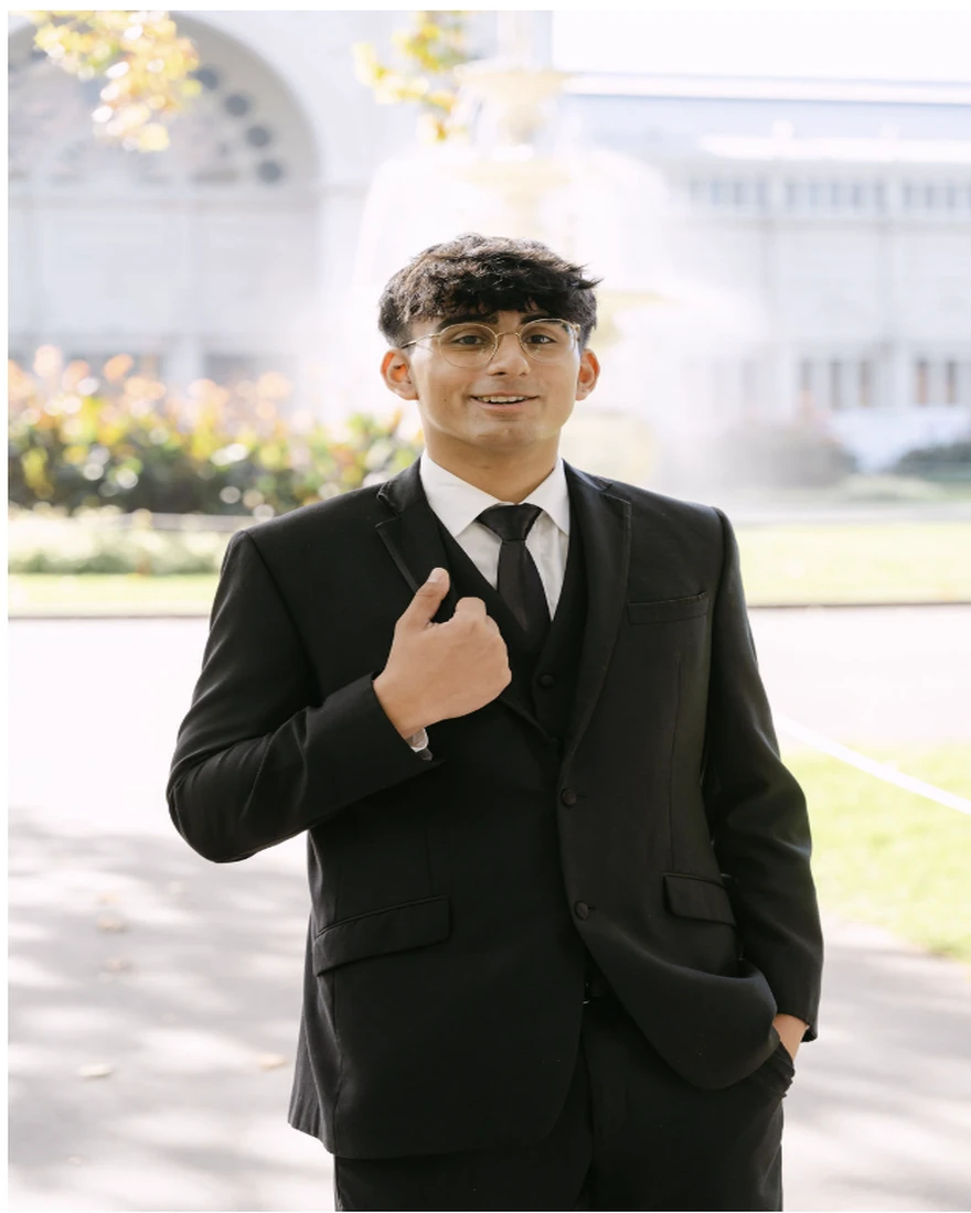 Gurshaan Sandhu | gurshaan-sandhu Gurshaan Sandhu, a Senior Administrative Officer, poses in formal wear outdoors.